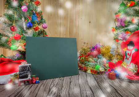 christmas ornaments christmas ornaments and Chalkboard on wood background.の写真素材