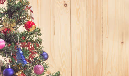 vintage tone image of christmas ornaments and vary of decoration on wood background.の写真素材