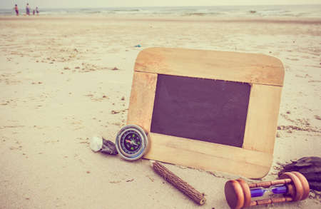 journey concept vintage tone image of chalkboard and stationery items For creative idea with blur...