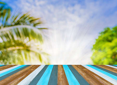 image of wood table and blur coconut tree for background usage.の写真素材