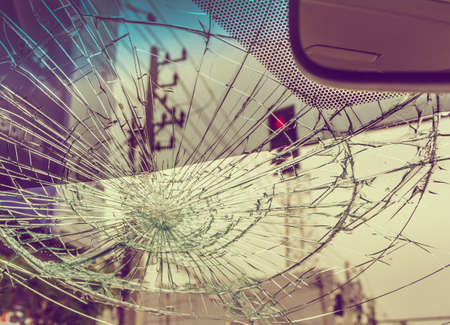 Selective focus image on Broken car windshield take photo from inside from accident of car.(vintage...