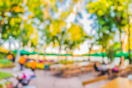 blur image of restaurant with bokeh on day time for background usage.の写真素材