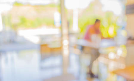 blur image of Coffee shop with bokeh on daytime for background usage .の写真素材