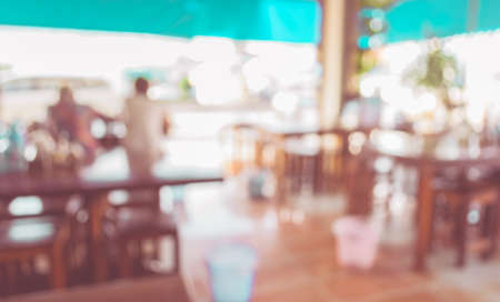 blur image of coffee shop with bokeh on day time for background usage .の写真素材
