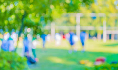 blurred student 's activity in soccer field at school on day time image for background usage.の写真素材
