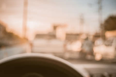 vintage tone blur image of inside cars with bokeh on day time for background usage.の写真素材