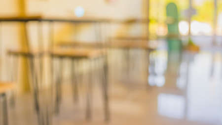 blur image of empty cafe with bokeh for background usage .