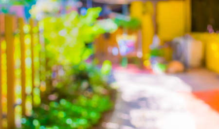 blur abstract image of walkway with open space to the green garden with bokeh for background usage .の写真素材
