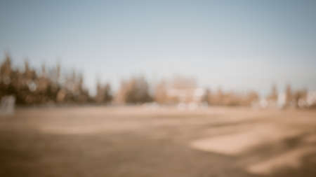 vintage tone image of blur grass field and blue sky for background.の写真素材