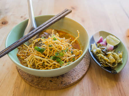 image of Curried Noodle Soup (Khao soi) with thai style spice, Northern Thai style cuisine.の写真素材