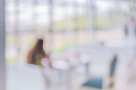 blur image of people sit in living room for background usage.の写真素材