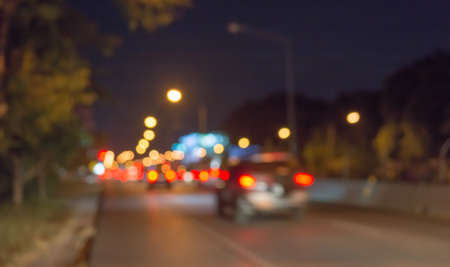 image of blur street bokeh with colorful lights in night time for background usage .