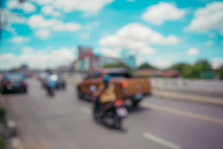 abstract blur of the road with car on day time for background usage. (vintage tone)の写真素材
