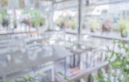 image of Abstract blurred outdoor table and chair in garden on day time for background usage . (vintage tone)の写真素材
