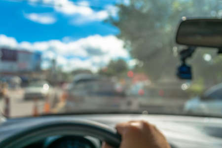 blur image of people driving car on day time for background usage.(take photo from inside)の写真素材