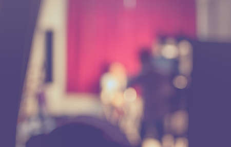 vintage tone blur image of photographer working in studio for background usage.の写真素材