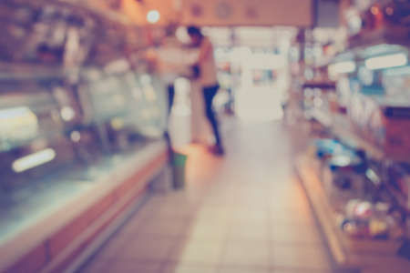 Customer in Coffee shop blur background with bokeh image.(vintage tone)の写真素材