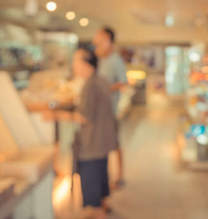 Customer in Coffee shop blur background with bokeh image.(vintage tone)の写真素材