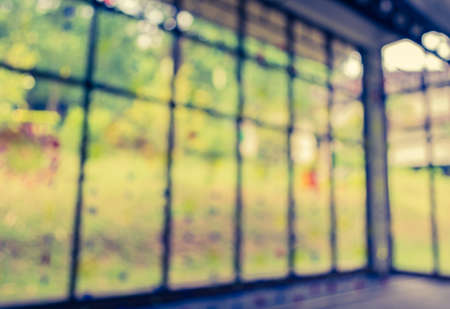 vintage tone image of blur window with bokeh for background usage.の写真素材