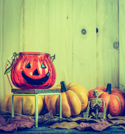 vintage tone image of Halloween pumpkin any vary ornament on wood table with Wooden background.の写真素材
