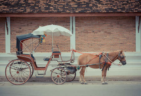 vintage tone image of The carriage designed for private passenger at Lampang province ,Thailand .の写真素材