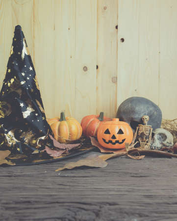 vintage tone image of Halloween pumpkin any vary ornament on wood table with Wooden background.の写真素材