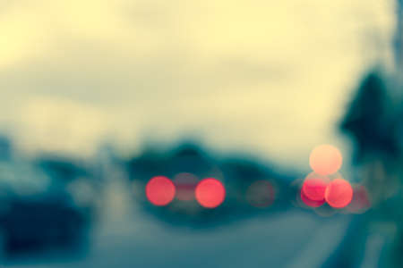 vintage tone image of blur street bokeh with colorful lights in evening time for background usage .の写真素材