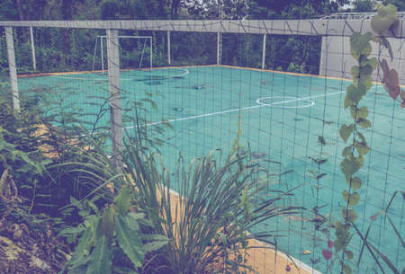 vintage tone image of old soccer goal in field.の写真素材