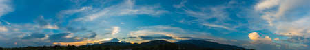 silhouette panorama shot image of tree and sunset sky in background.の写真素材
