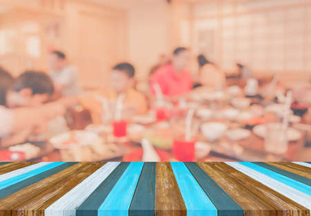 wood table and Chinese restaurant blur background with bokeh image .