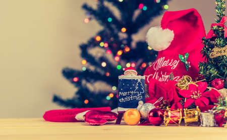 vintage tone image of Christmas baubles and vary of decoration on wood background.の写真素材