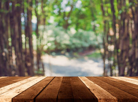 vintage tone image of wood table green bamboo forest and roof.の写真素材