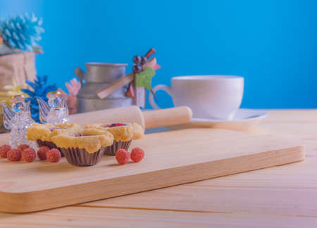 image of blueberry Crumb Cake on wood table with vary decoration in background.