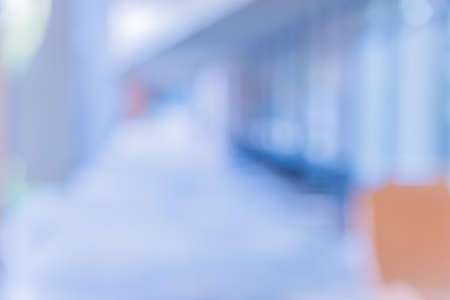 blur image of hospital office room with table and chairs for background usage.