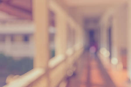 vintage tone image of blur empty long corridor for background usage .の写真素材