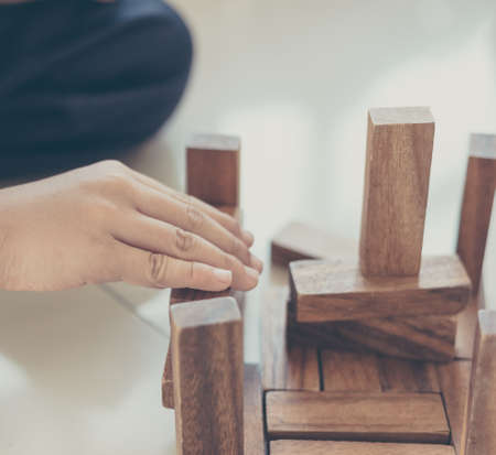 close up image of boy hand play wood game.の写真素材