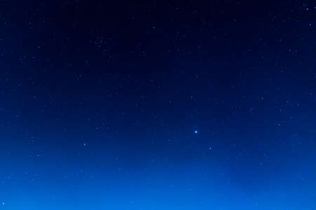 long exposure shot image of beautiful blue sky and stars in background.の写真素材