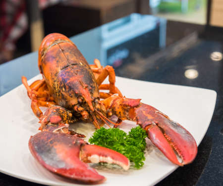 image of grill canadian lobter on plate in restaurant.の写真素材