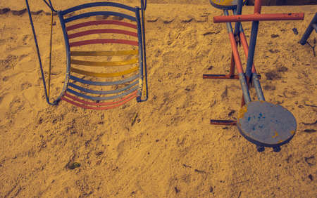 vintage tone image of swing in park.
