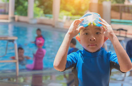 image of asian boy at swimming pool.の写真素材
