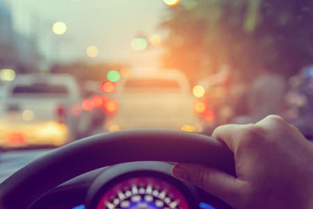 image of people driving car on day time for background usage.(take photo from inside focus on driver...
