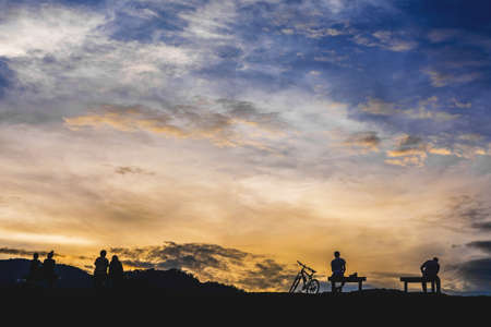 silhouette image of people have outdoor activity on sunset time with beautiful blue sky for background usage.の写真素材