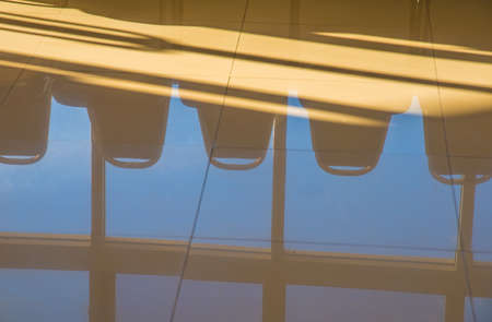 image of sky reflected on floor in hospital office hallwayの写真素材