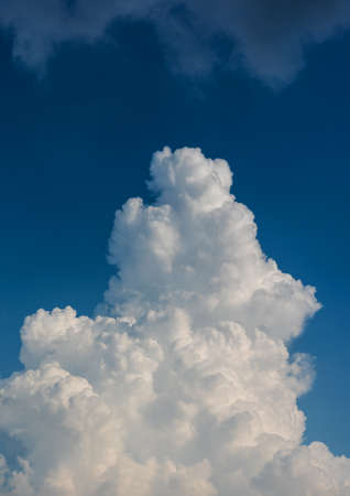 image of blue sky and white clouds on day time for background usage.(vertical)の写真素材