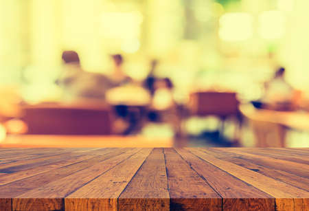 Coffee shop and people sit on table blur background with bokeh image.(vintage tone)の写真素材
