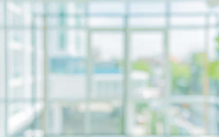 blur image of hospital office room with modern style square windows for background usage.の写真素材