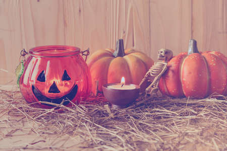 vintage tone image of Halloween pumpkin and vary ornament on wood table with Wooden background.の写真素材