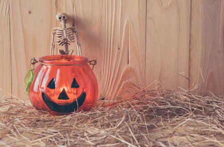 vintage tone image of Halloween pumpkin and vary ornament on wood table with Wooden background.の写真素材