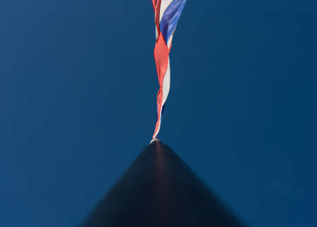 Flag of Thailand with clear blue sky for background.の写真素材