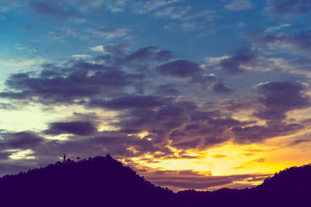 minimalist style image of Old temple and holy Buddha statue on mountain at Wat Phra That Doi Kham temple, Chiang Mai , Thailand.(vintage tone)の写真素材